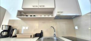 a kitchen with a sink and a counter top at Knossos Sunrise in Palekastron +34 photos