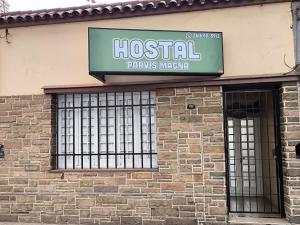 a hospital sign on the side of a brick building at Parvis Magna Hostal in Guaymallen