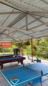 two ping pong tables in a pavilion at La melosa in Girardot