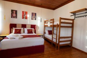 a bedroom with two bunk beds and a ladder at Fabiani Boutique Hotel Castle Gate in Krujë