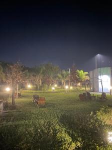 a park at night with lights in the grass at Costa Termal 9 in Chajarí