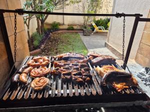 a grill with many different types of food on it at Casa Hanami, habitación doble excelente ubicación in Salta +28 photos