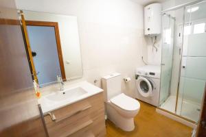 a bathroom with a toilet sink and a washing machine at House Los Angeles in Chulilla +28 photos