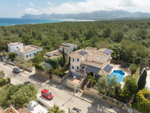 an aerial view of a house with a parking lot at Your Island Villa Son Serra in Son Serra de Marina