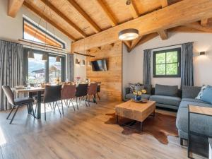 a living room with a couch and a table at Chalet Joep in Wald im Pinzgau
