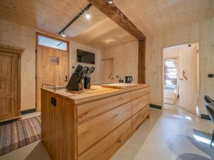 a kitchen with a wooden counter in a cabin at Raneburg 4 Futterhaus in Matrei in Osttirol
