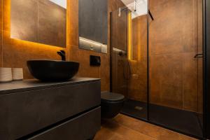 a bathroom with a sink and a toilet at Rooms with a parking space Mali Losinj (Losinj) - 9681 in Mali Lošinj +53 photos