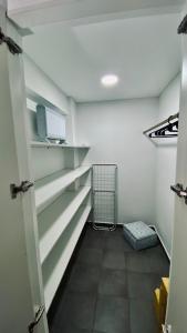 a room with shelves and a shopping cart in it at Lomajobava in Godoy Cruz