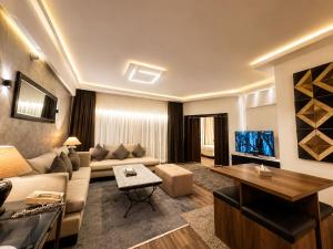 a living room with a couch and a table at Private Luxury Villas at Sharm Dreams Vacation Club in Sharm El Sheikh