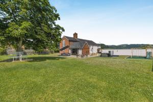 an image of a house with a yard at 7 Bed in Welshpool oc-96412 in Berriew