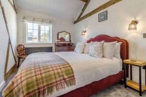 a bedroom with a large bed and a window at 7 Bed in Welshpool oc-96412 in Berriew