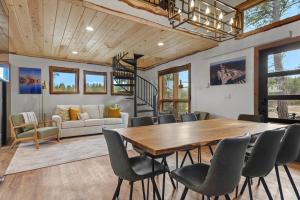 a dining room with a table and chairs at Hottub Haven BHBungalows #9 in Custer