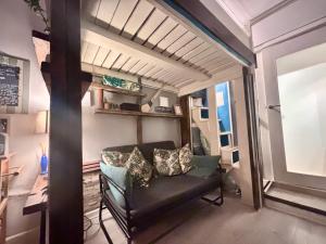 a living room with a couch and a window at Studio at 39 in Dublin