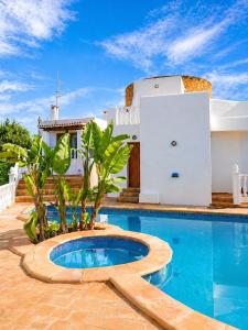 a swimming pool in front of a house at Excelente villa With pool ibiza in Santa Gertrudis de Fruitera