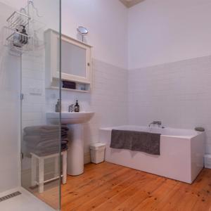 a bathroom with a sink and a bath tub at Cape Nelson Lighthouse in Portland +102 photos
