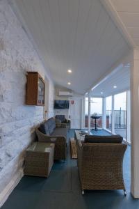 a living room with a couch and chairs at Cape Nelson Lighthouse in Portland