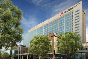 a large building with a marriott sign on top of it at Louisville Marriott Downtown in Louisville
