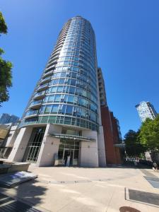 a tall building with a lot of windows at Vancouver Downtown Accommodation in Vancouver