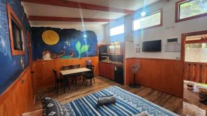 a room with a table and a dining room at HARE O HAUPIANO in Hanga Roa