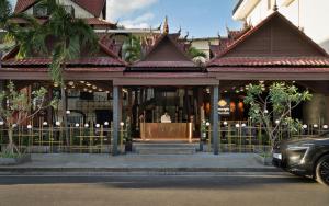 a building with a podium in front of it at The Palace Indochine Hotel in Siem Reap +96 photos