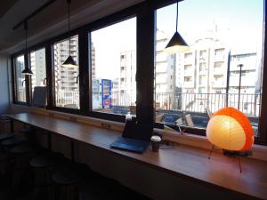 a laptop sitting on a desk in front of a window at Oak Hotel Edo in Tokyo