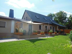 a house with solar panels on the lawn at Landhaus Huchatz in Burg