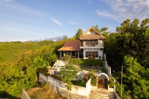 an aerial view of a house on a hill at Villa Treetop, 2BR with spectacular ocean view in Nusa Penida