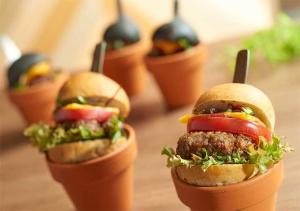 a group of four mini hamburgers on a table at Shibuya Tokyu REI Hotel in Tokyo