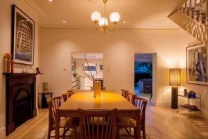 a dining room with a table and chairs at Sublime Luxury - Battery Point in Hobart