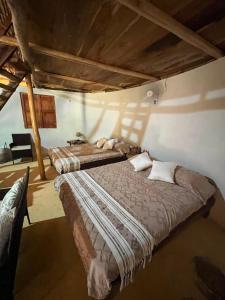 a bedroom with two beds in a room at Eco Hacienda ICH-KI in Hoctún
