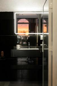 a bathroom with a sink and a window at Chanchill Glamping&cafe in Xuân Thọ +96 photos