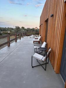 a row of chairs sitting on top of a building at Casa Zaan in Sulina