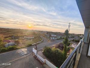 a view of a street from a balcony of a building at Vibgyor Hotel in Cherrapunji
