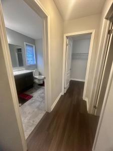 an empty room with a toilet and a hallway at Gifted Beautiful Home in Brampton