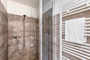 a shower with a glass door in a bathroom at Residenza La Serenata in Cavigliano +93 photos