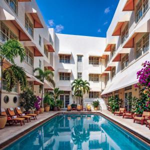an exterior view of a hotel with a swimming pool at The Betsy Hotel, South Beach in Miami Beach