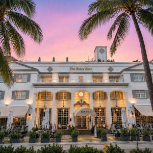 a hotel with palm trees in front of a building at The Betsy Hotel, South Beach in Miami Beach