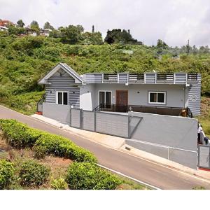 a house on the side of a road at Revival Villa in Coonoor