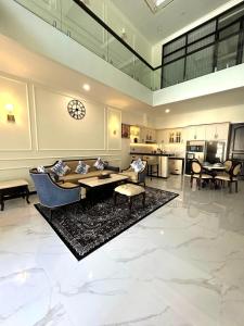 a living room with a couch and a table at Royal Classic Puncak in Cisarua
