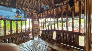 a room with a large screen in a building at Rendan Kubo in Batangas City