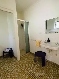 a bathroom with a sink and a shower at Lorne Beach House in Lorne +29 photos