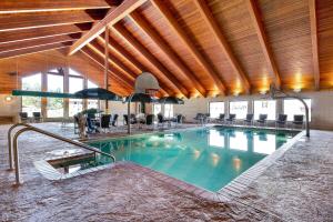 a large swimming pool in a large building at AmericInn by Wyndham Wisconsin Dells in Wisconsin Dells