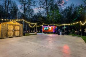 a parking lot with lights and a food truck at AmericInn by Wyndham Wisconsin Dells in Wisconsin Dells +81 photos