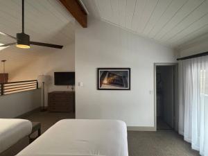 a bedroom with two beds and a tv on the wall at Bluegreen Vacations Streamside at Vail, an Ascend Collection Resort in Vail +36 photos