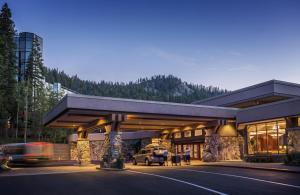a building with a car parked in front of it at Everline Resort and Spa, Lake Tahoe in Olympic Valley