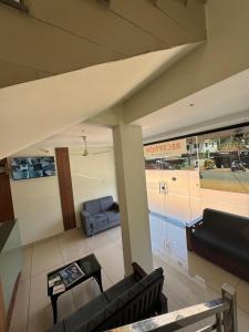 a living room with a couch and a table at Regal residency in Perintalmanna