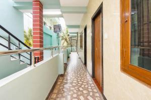 an empty corridor of a building with a walkway at Collection O Tennati Park Vizag Beach Formerly B Square Villa in Visakhapatnam