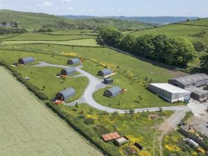 an aerial view of a farm with a winding road at Rowan in Ulverston