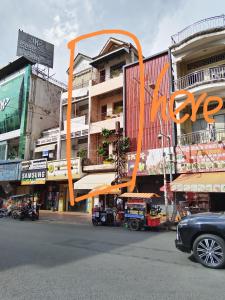 an orange sculpture on the side of a building at Monica's house in Phnom Penh