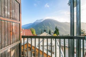 a view of a mountain from a balcony at Champlas Suite - Happy Rentals in Sestriere +14 photos